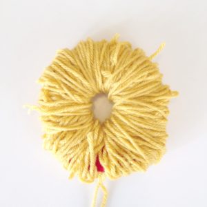 done winding all the Yarn | How to Make a Pom Pom Burger | Cool Pom Pom DIYs | Make a Pom Pom with Yarn from the Pop Shop America blog