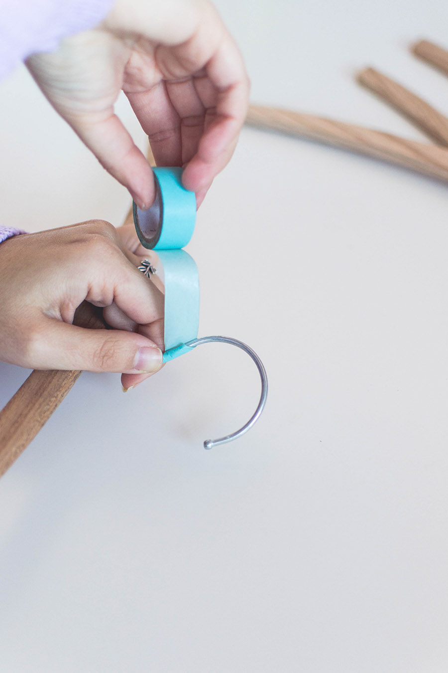 DIY rose gold hangers how-to: cover the hooks with washi tape