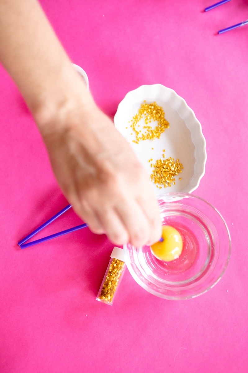 dip the lollipop in water to make glitter lollis