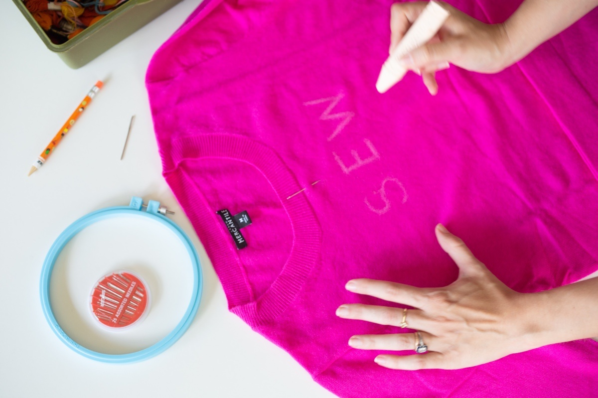 write the words in chalk to make an embroidered sweater