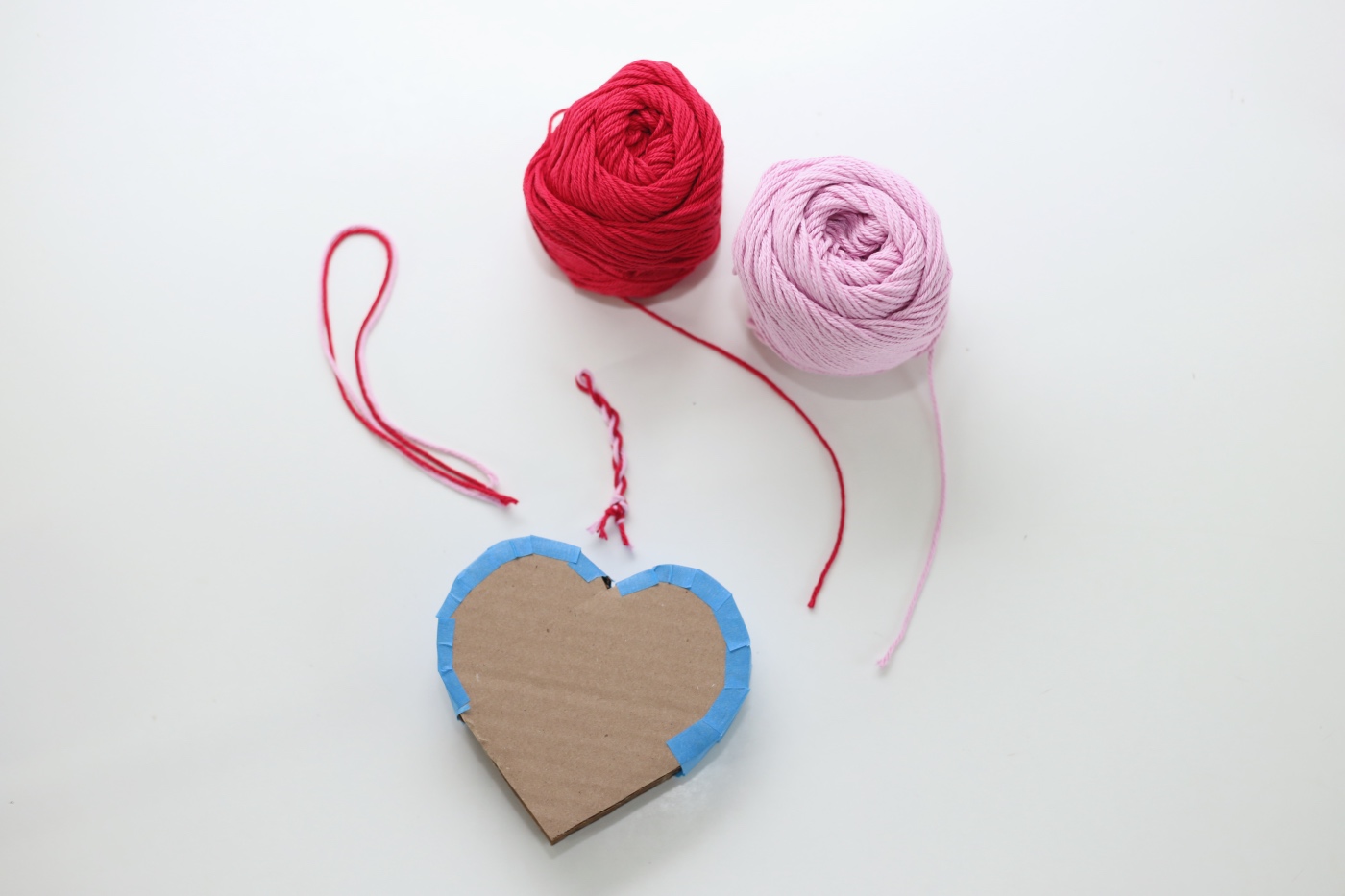 add a twist of yarn to the top mini heart pinata diy