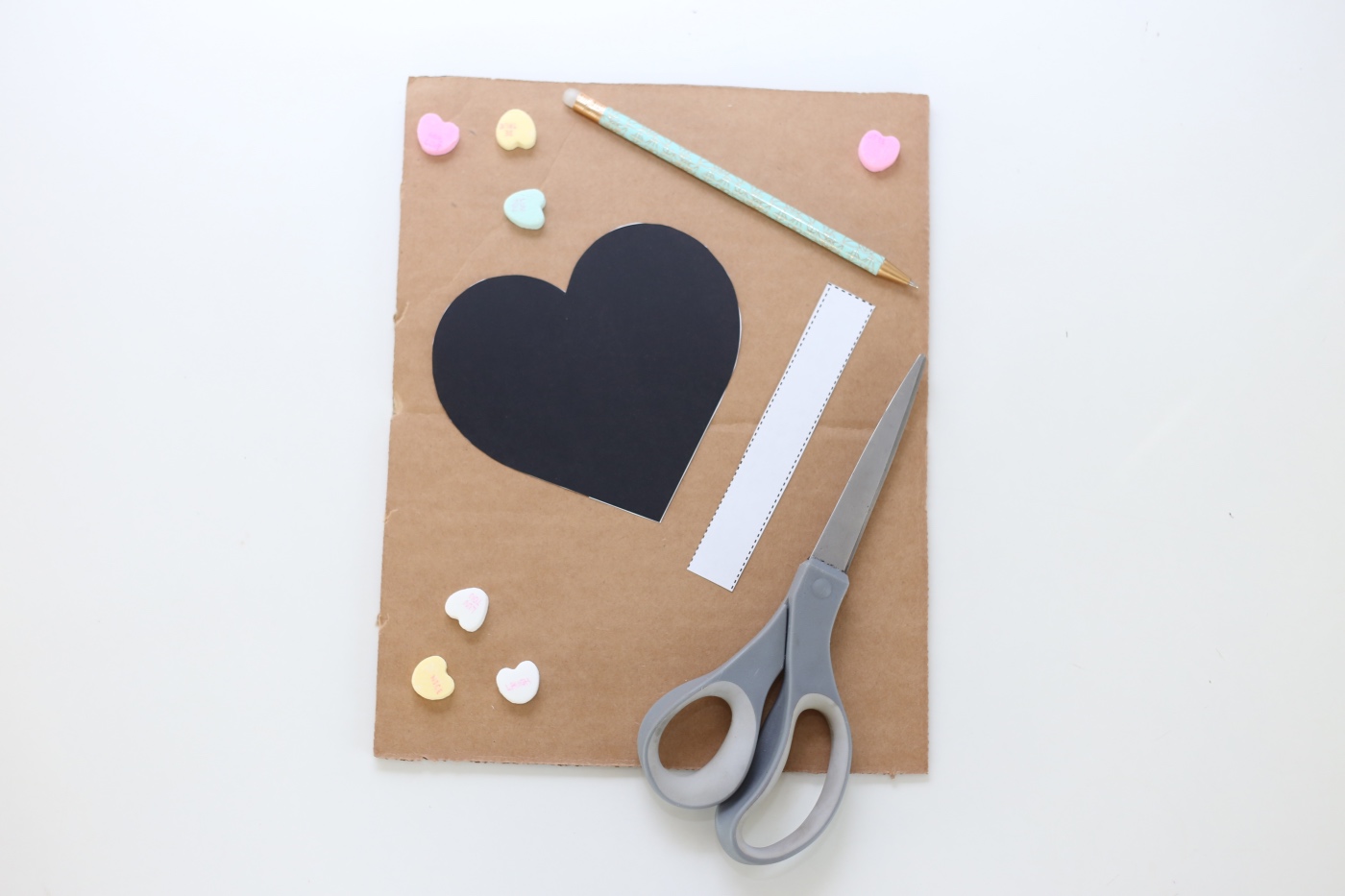 trace the template on the cardboard diy heart pinata