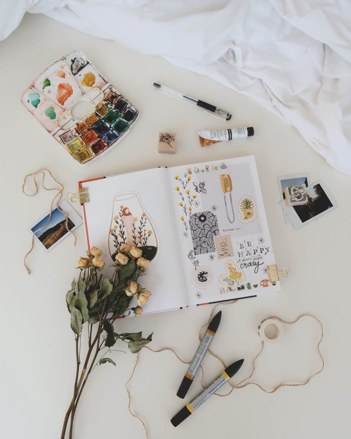 use watercolor, polaroids and other supplies to make a stylish bullet journal