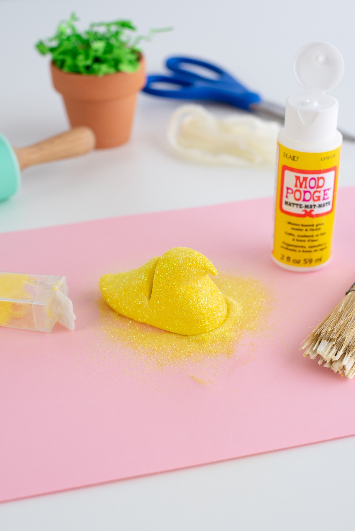 coat the clay peep in mod podge and glitter