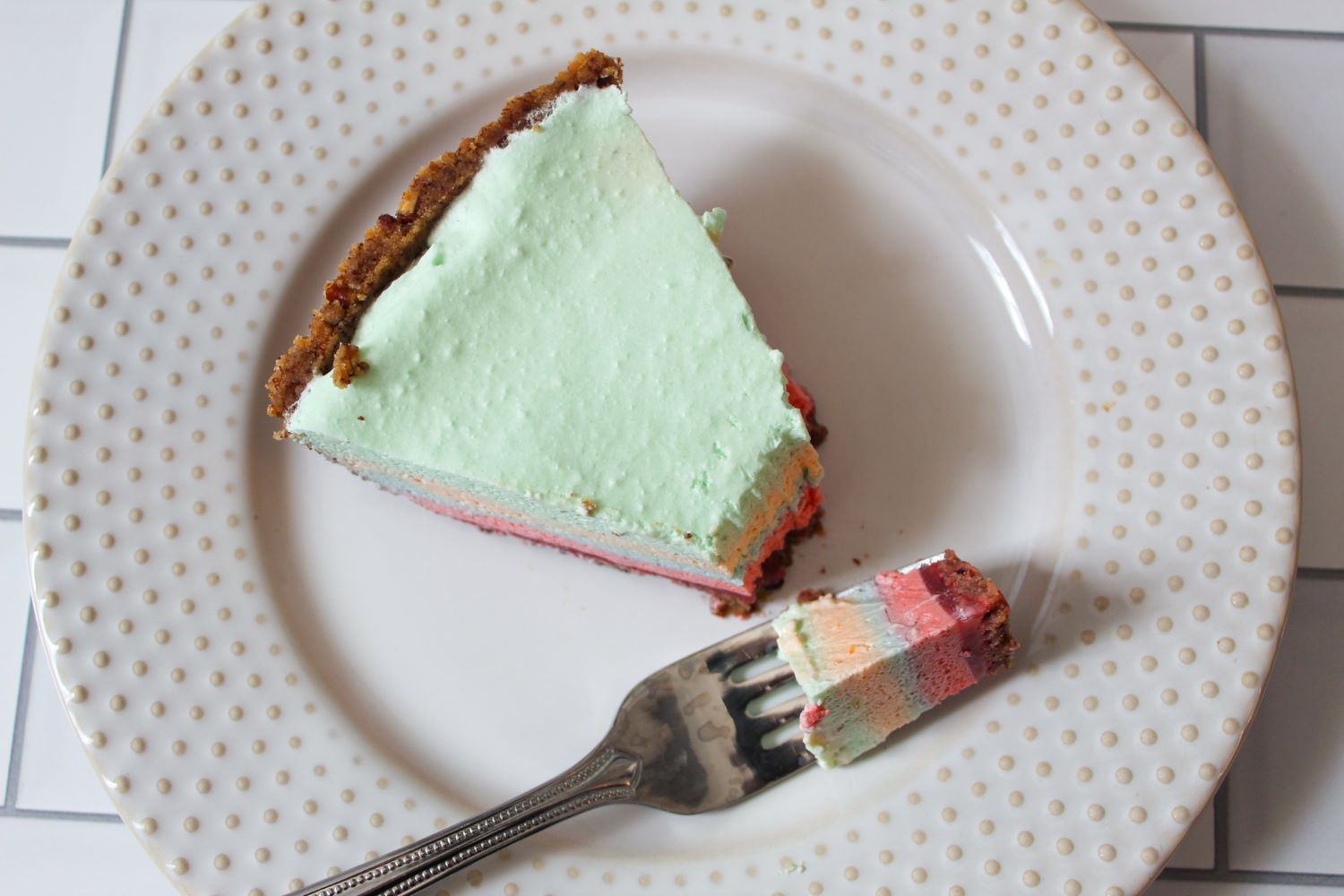 fork bite of layered pastel easter pie