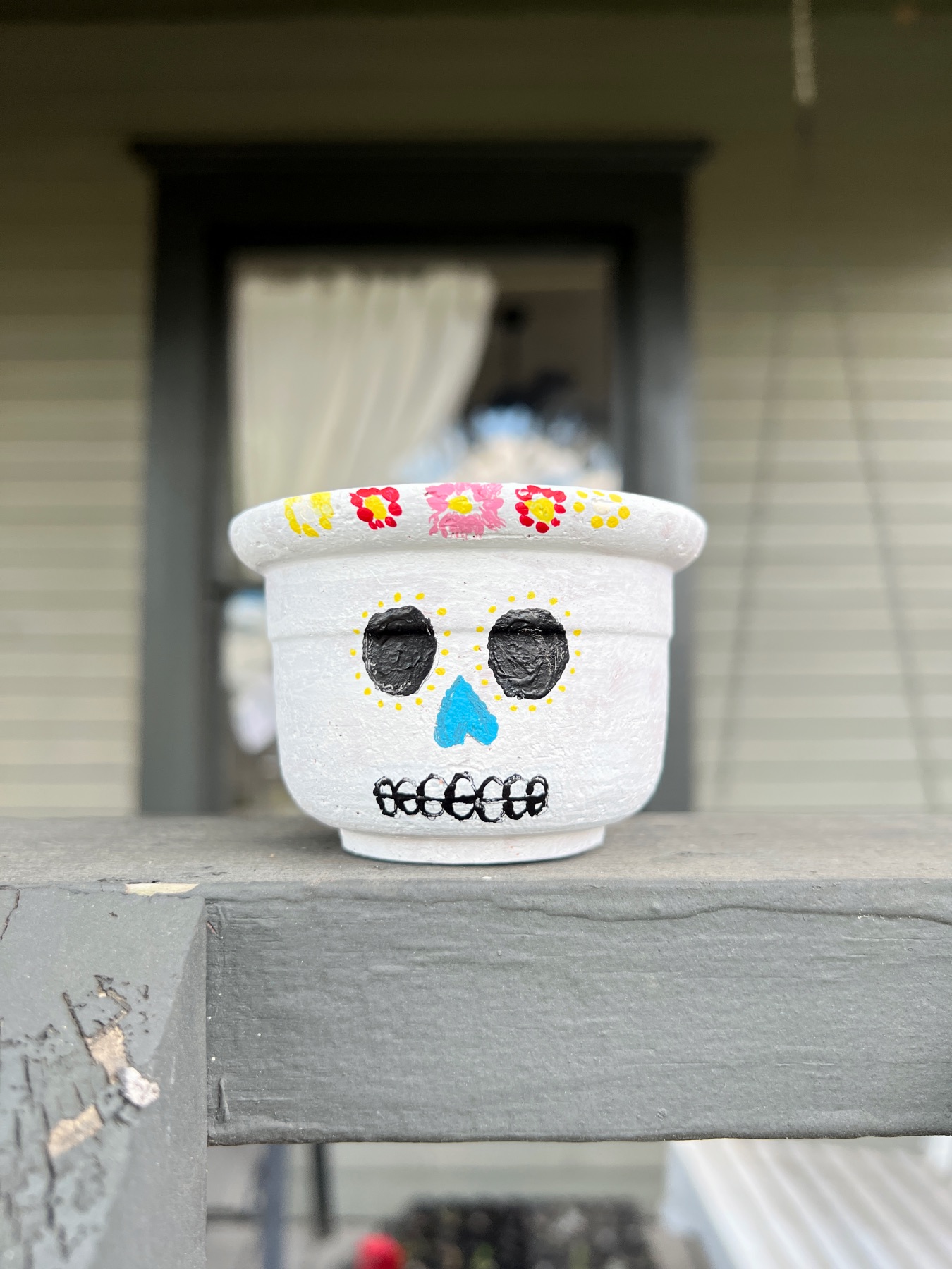 finished painted planter with a sugar skull