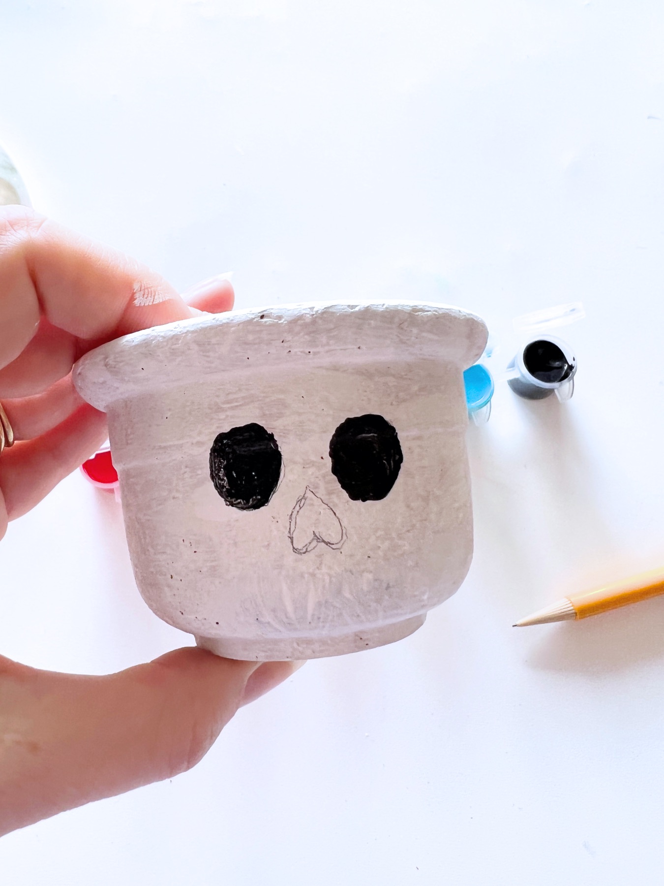 paint in the eyes of the sugar skull planter