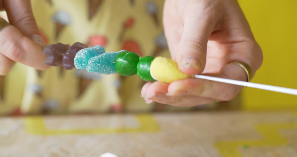 skewer the candies - how to make rainbow candy kabobs pop shop america