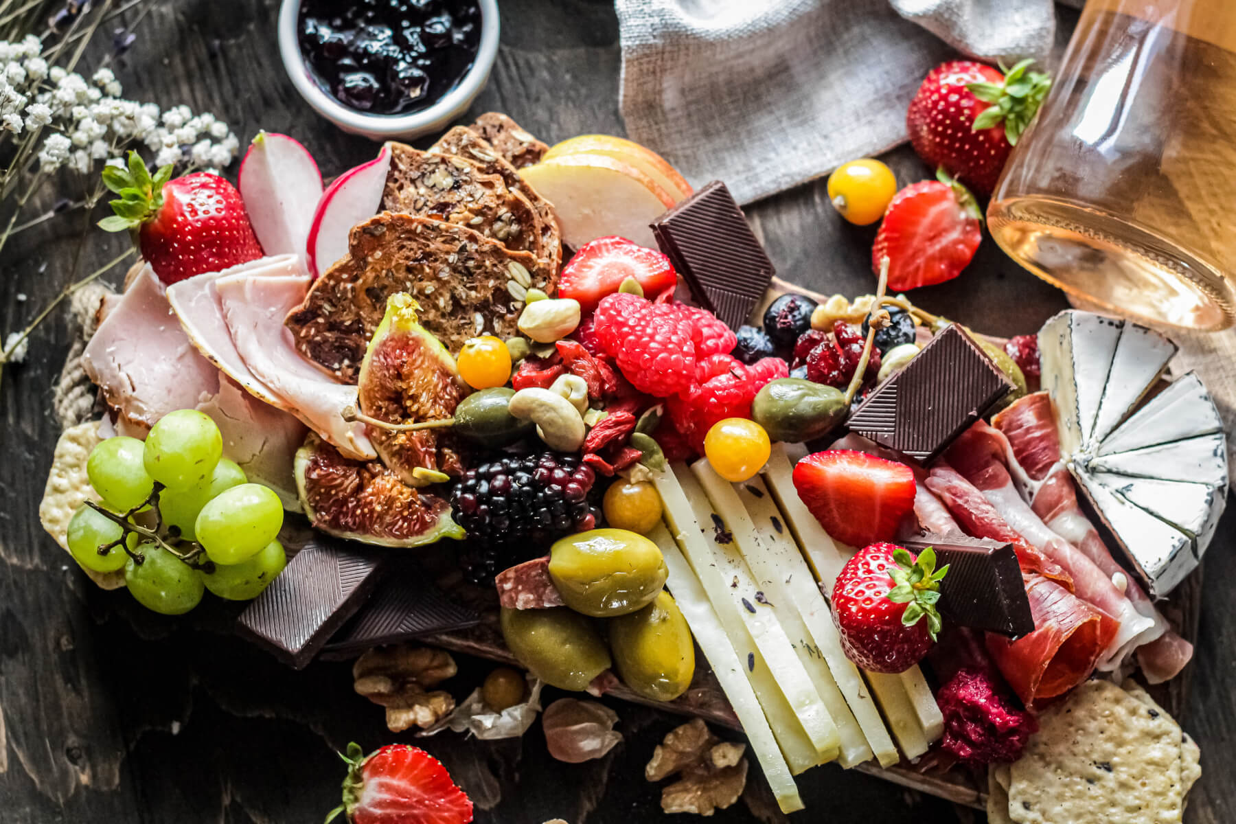 cheese plate with chocolate, fruit and more