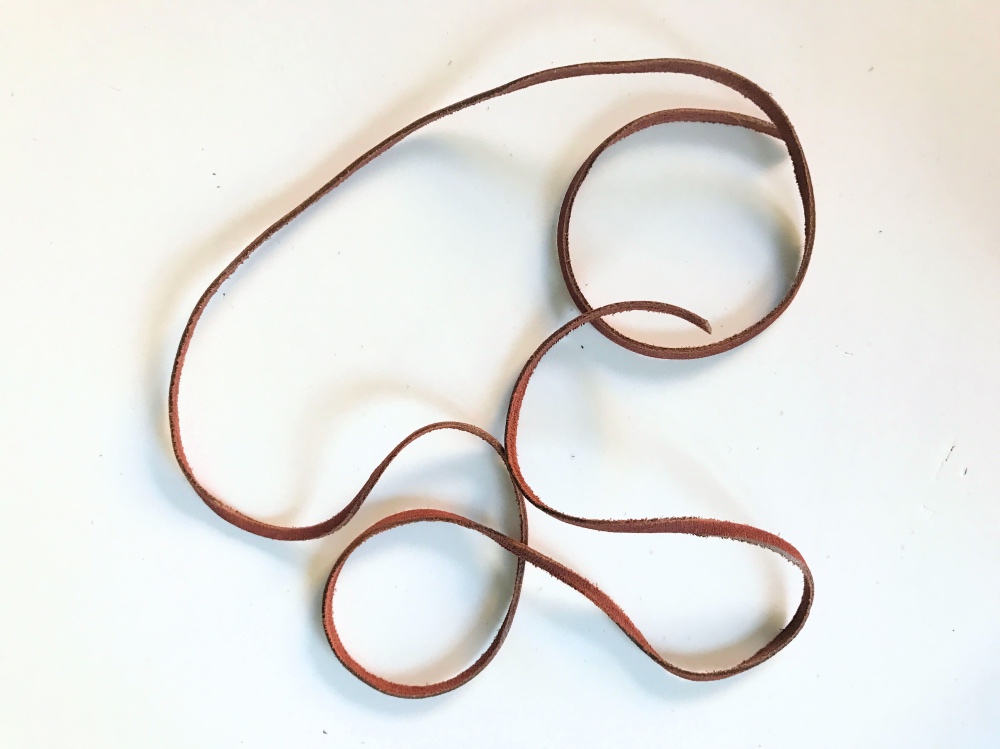 cut a length of the leather to make a diy leather lauriat necklace