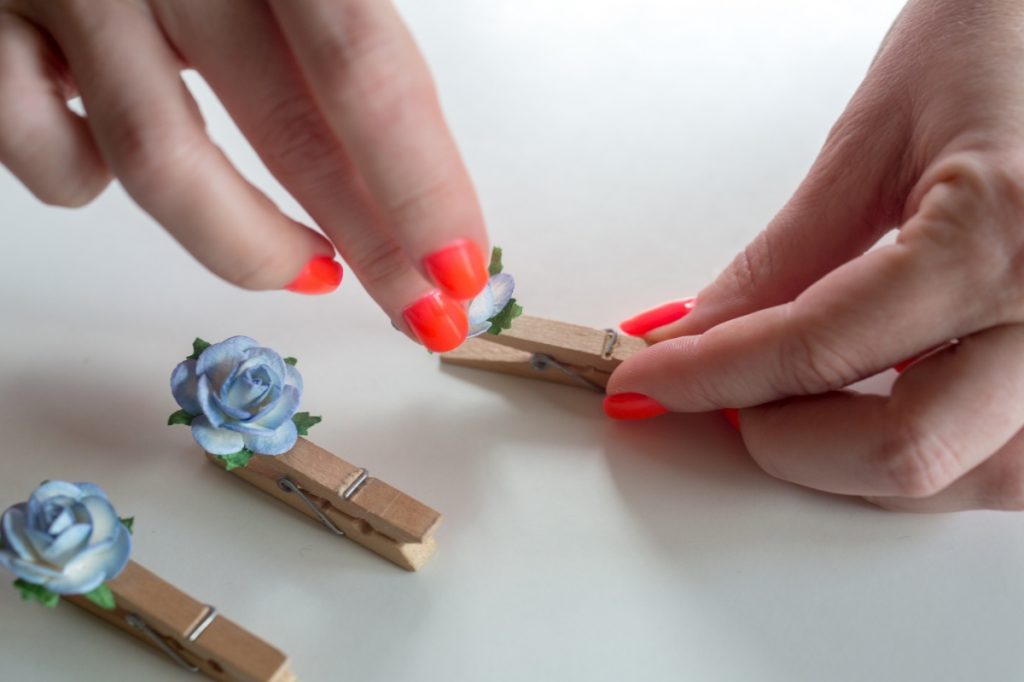 press the flowers in the hot glue diy clothespins with flowers