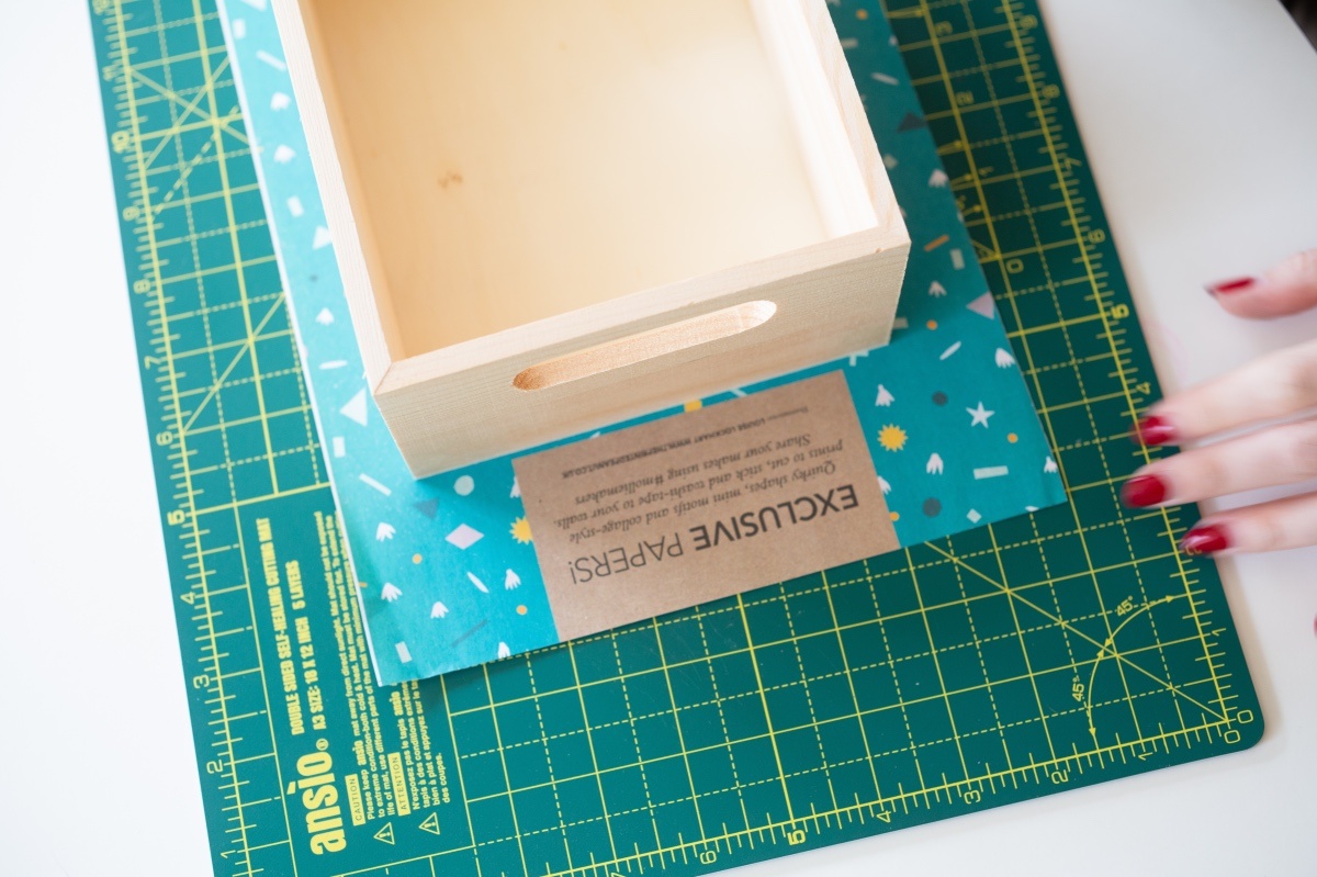 add paper behind the wooden box with mod podge