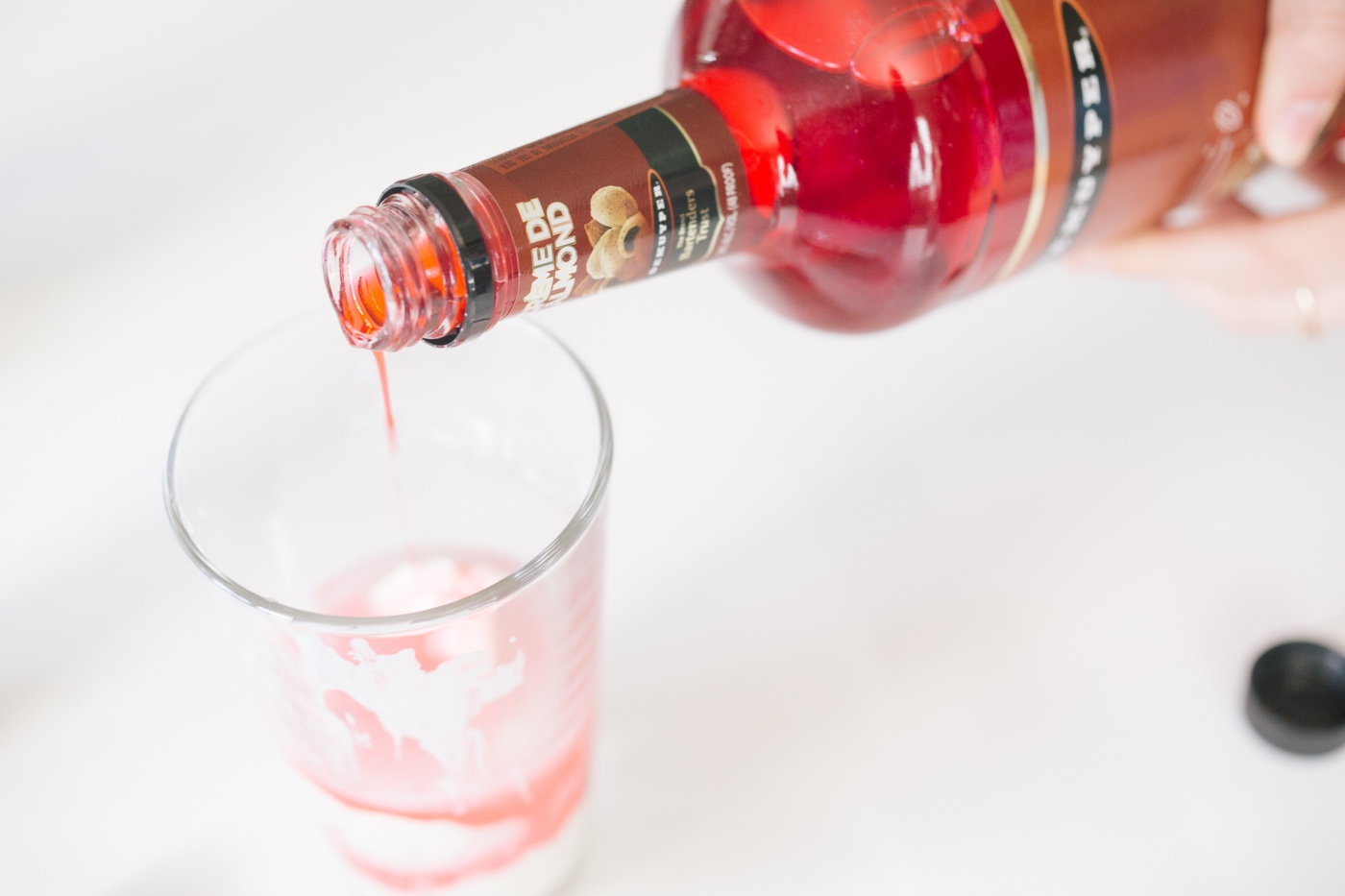 add the creme de almond to the skinny pink squirrel cocktail recipe