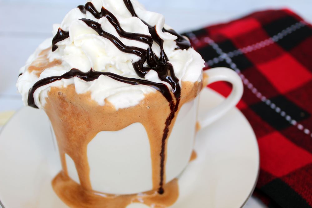 closeup of peppermint mocha latte with whipped cream 1