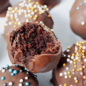 closeup of bitten brownie cheesecake truffle 1