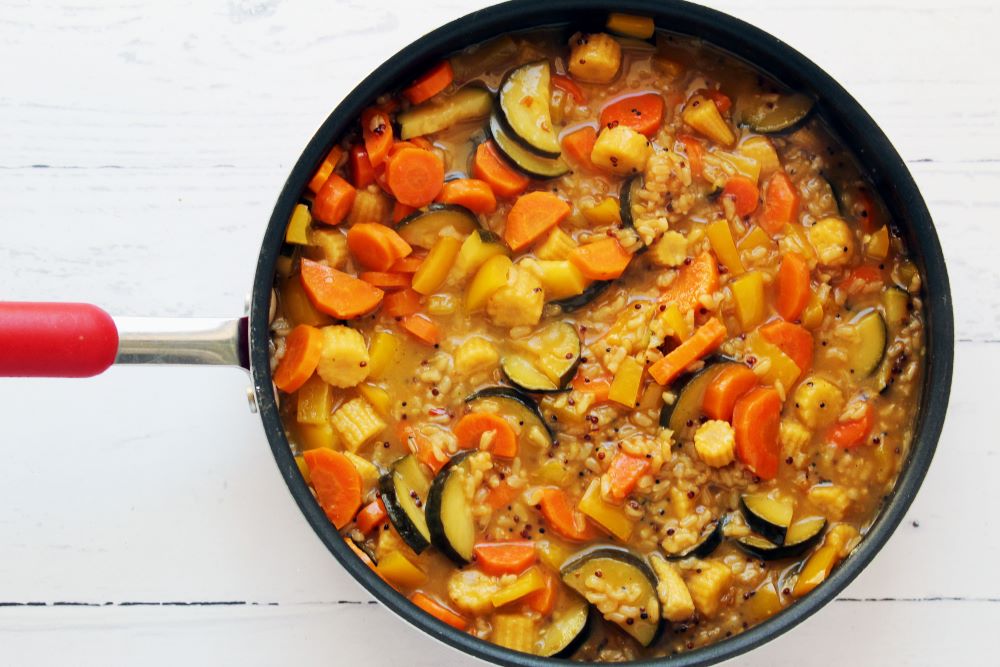 turmeric chicken and rice in red skillet 1
