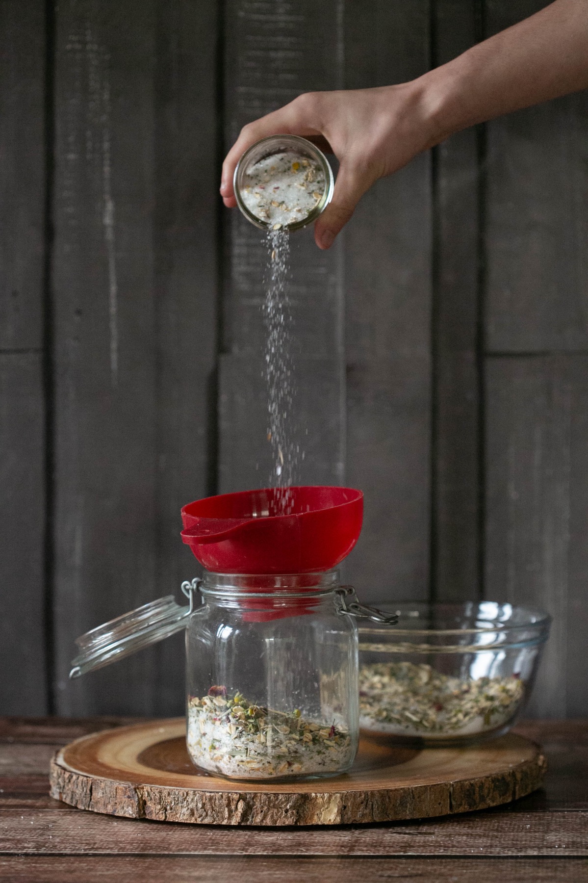 pour your homemade bath soaks into a glass container