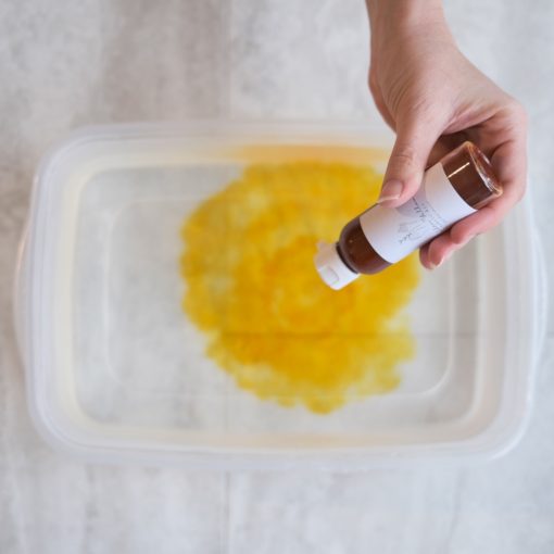 add-yellow-dye-to-hot-water-for-dip-dyeing-fabric_square