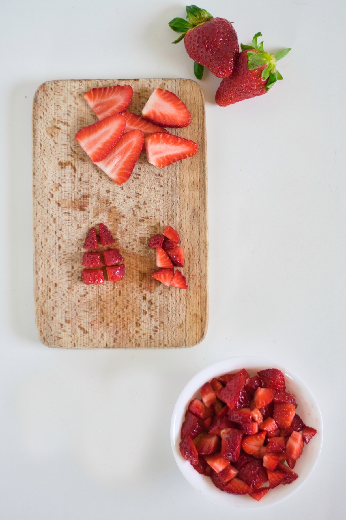 chop strawberries into chunks to make a strawberry crumble