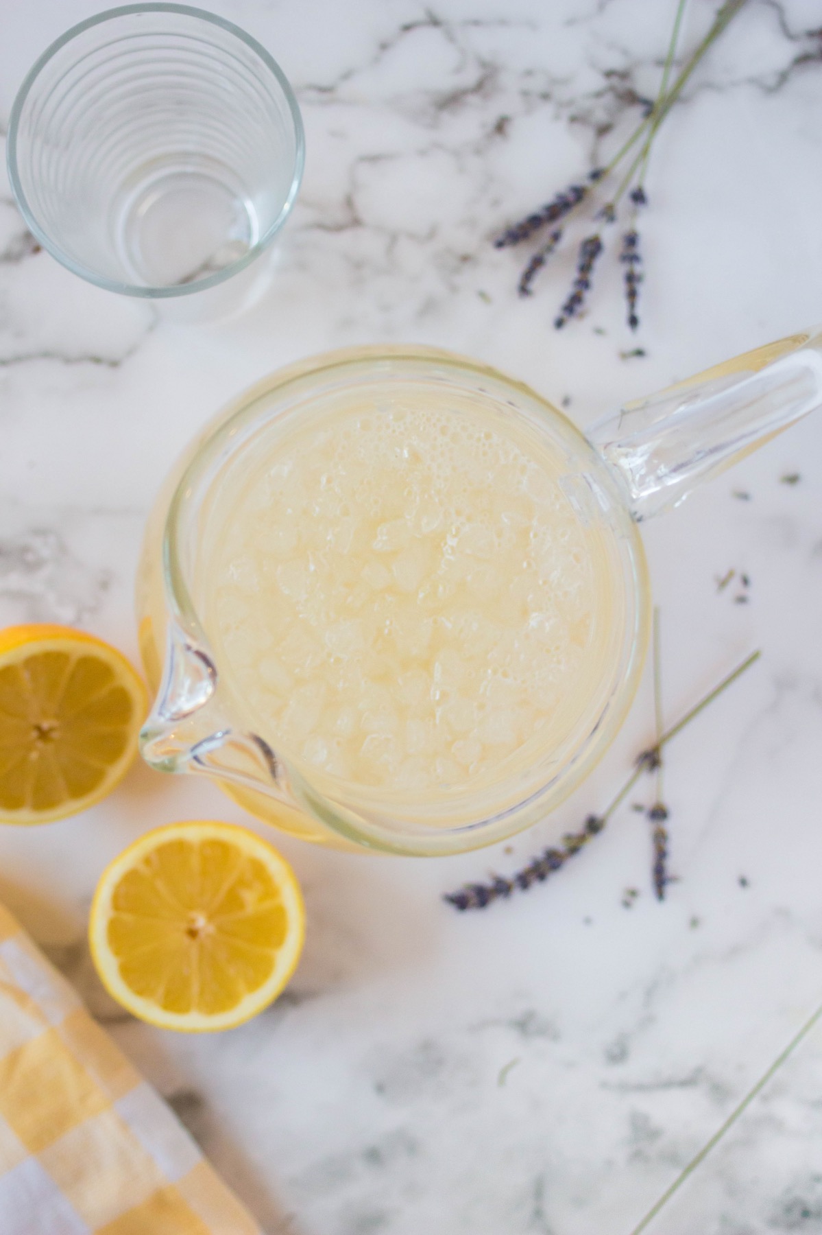 pour the homemade lavender lemonade recipe into the pitcher
