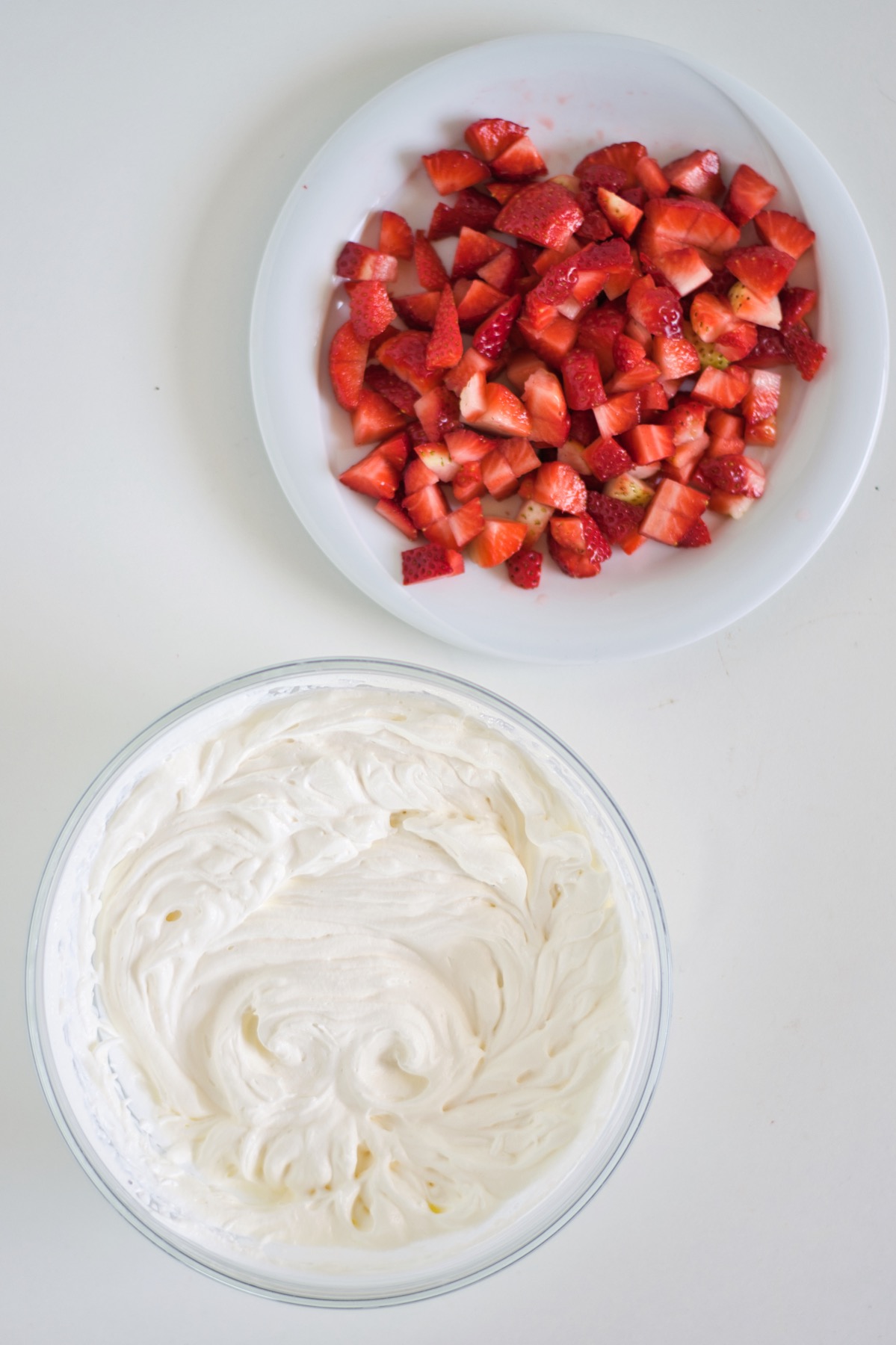 whip the cream and mix with the strawberries