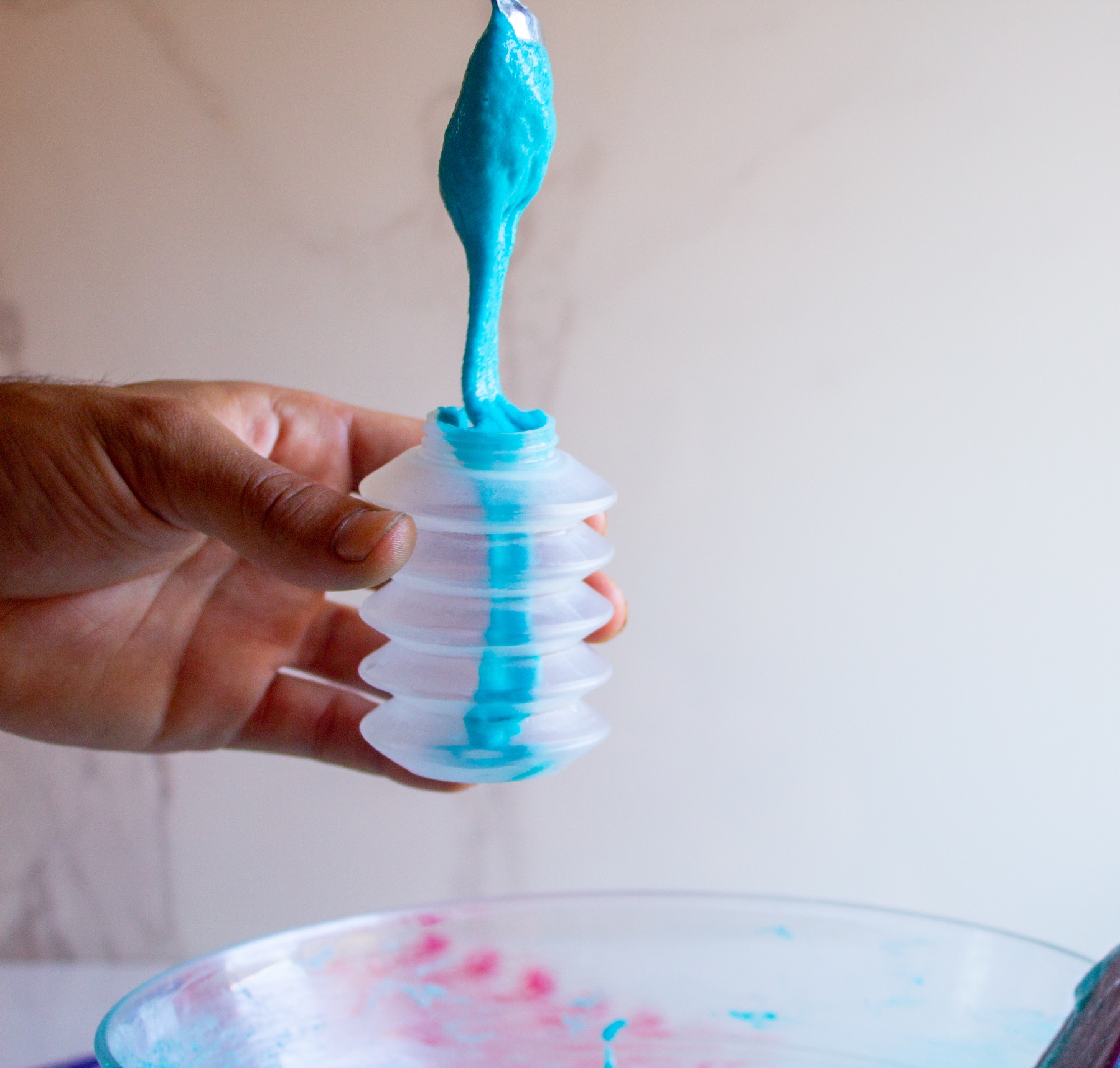 add the blue macaron batter to a squeeze bottle