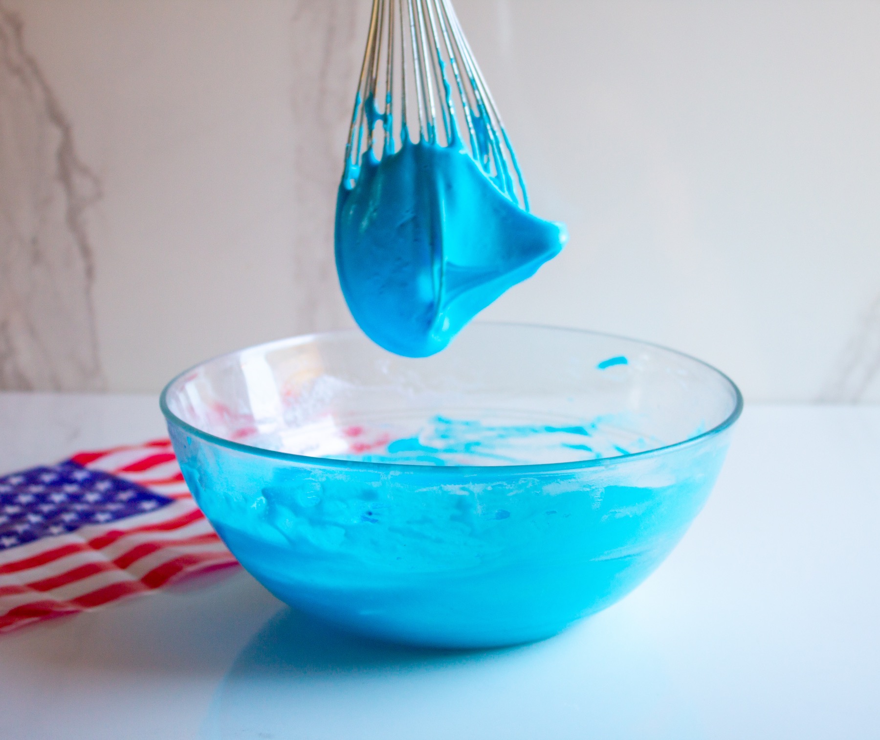 whip the egg whites with blue food coloring