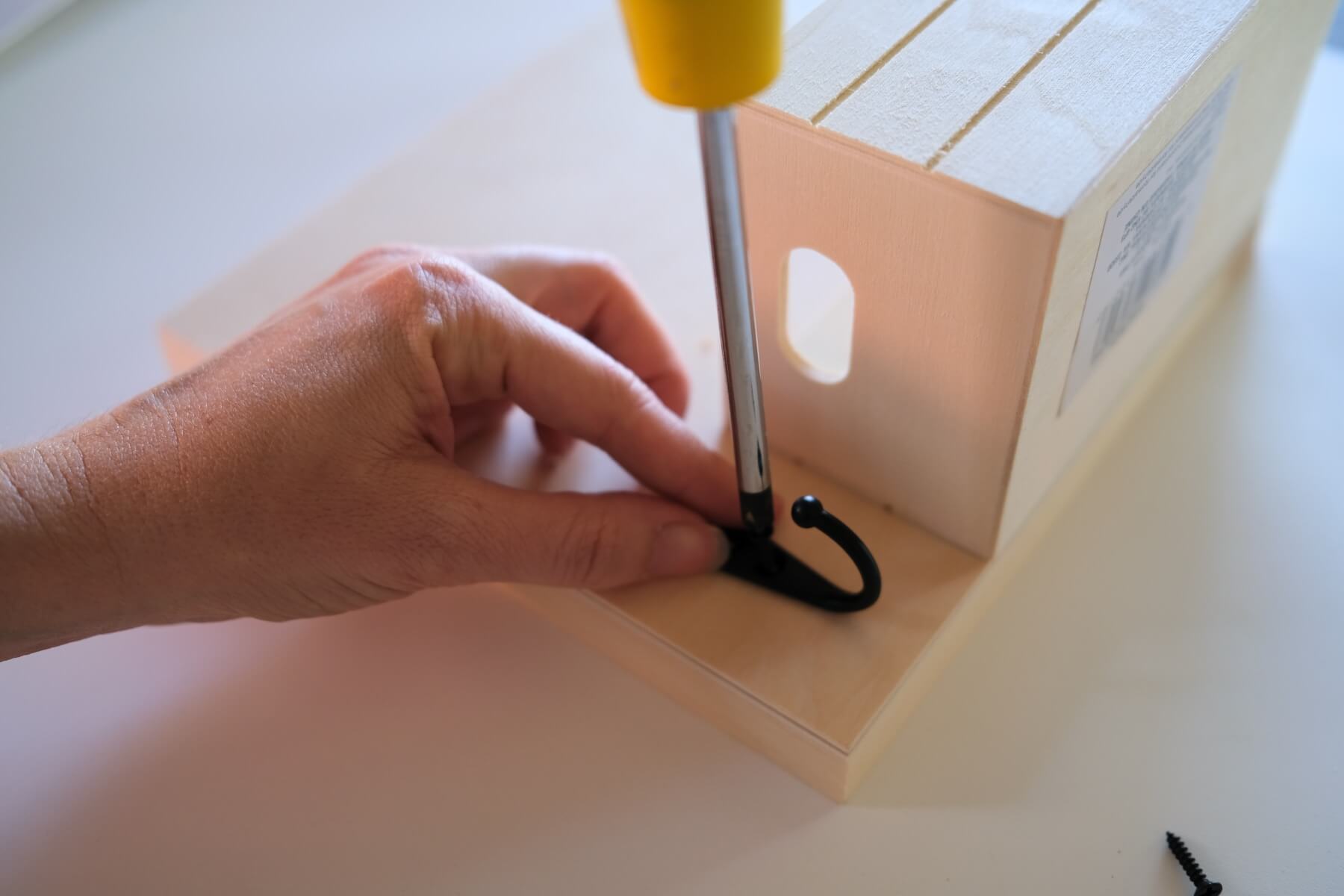 attach the key hook to the wood frame diy