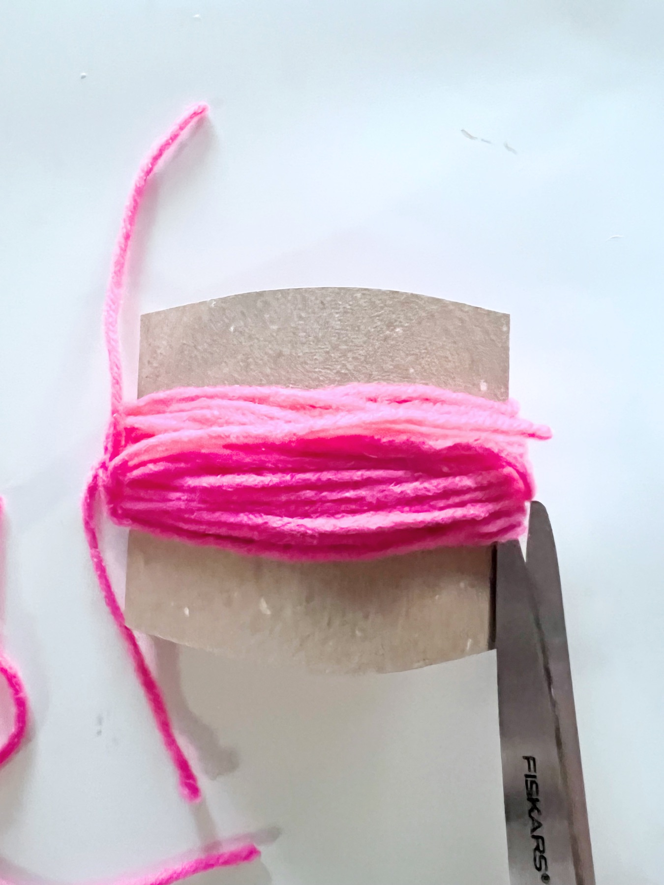 cut the winding yarn to make a tassel
