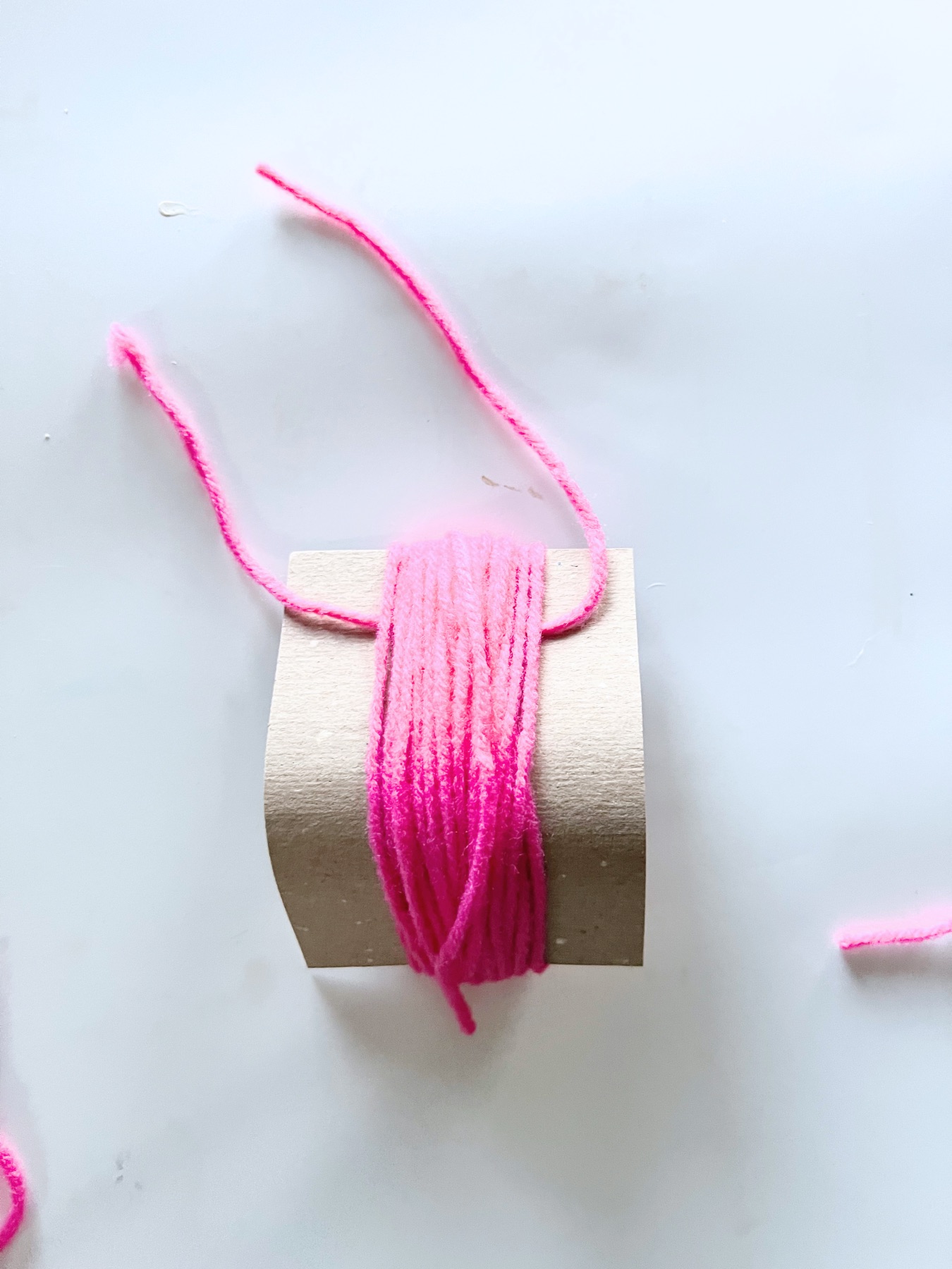 make a short length of yarn to make a tassel