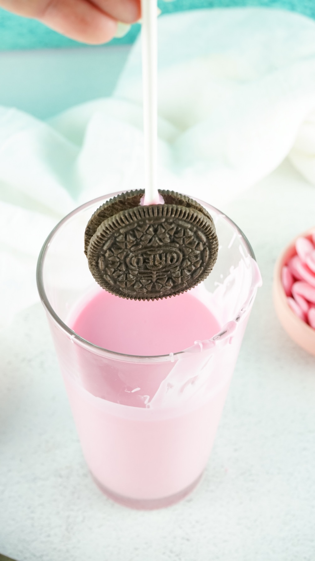 dip the oreo cookies in the pink chocolate